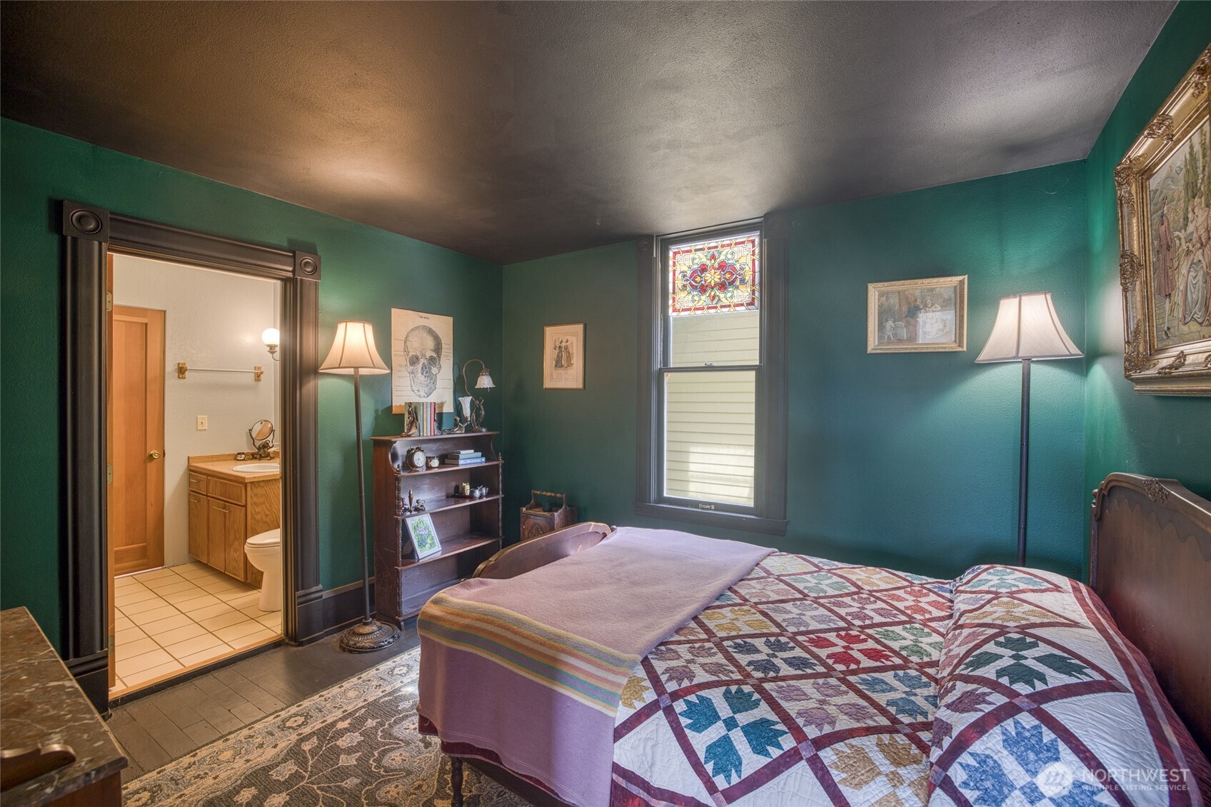 209 Ferry Street South Bend, WA 98586 - Photo 25 of 39 a bedroom with a bed and a mirror