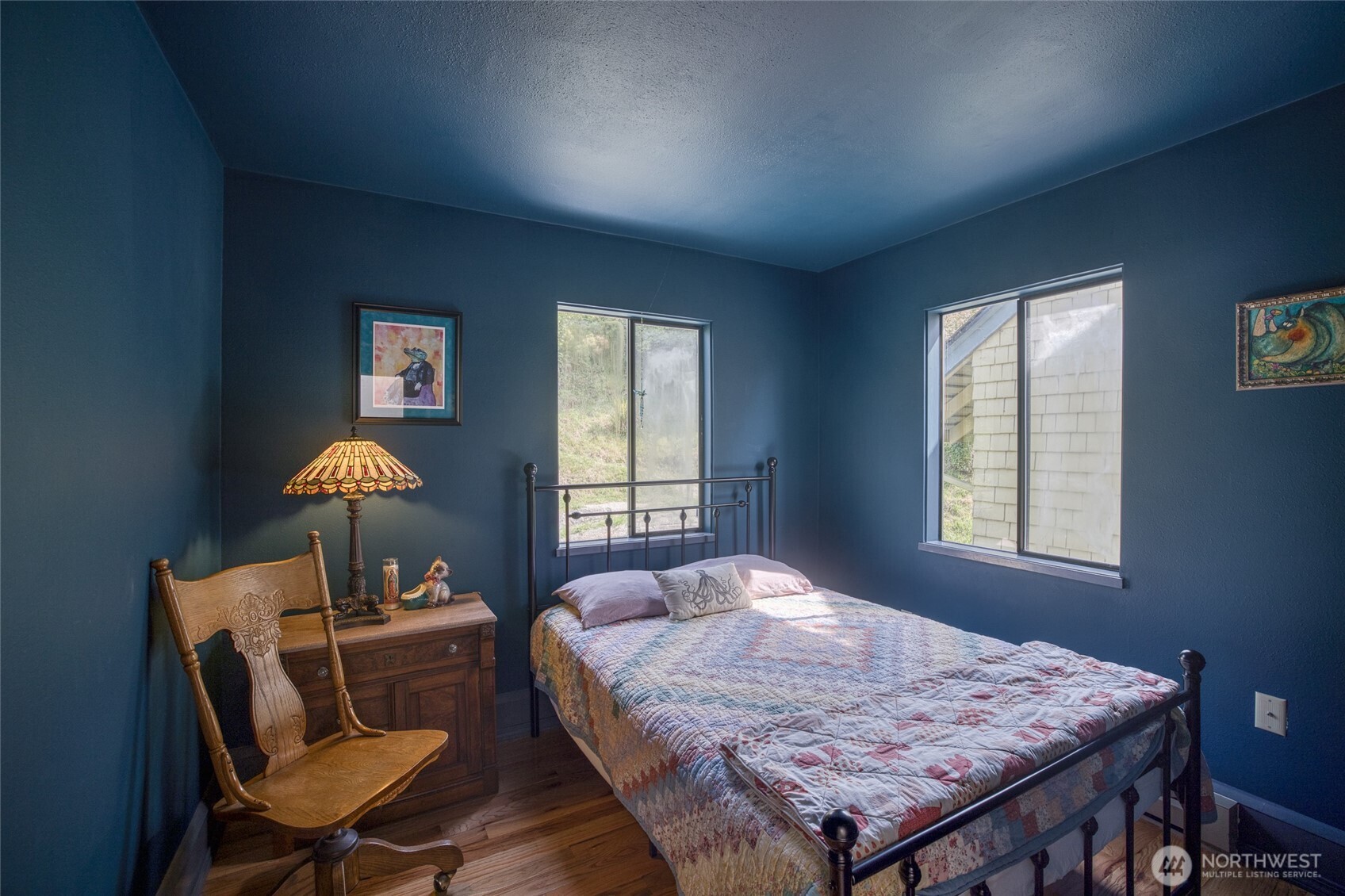 209 Ferry Street South Bend, WA 98586 - Photo 28 of 39 a bedroom with a bed and a table in it