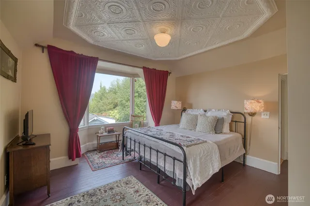 a view of a kitchen with a sink and a refrigerator