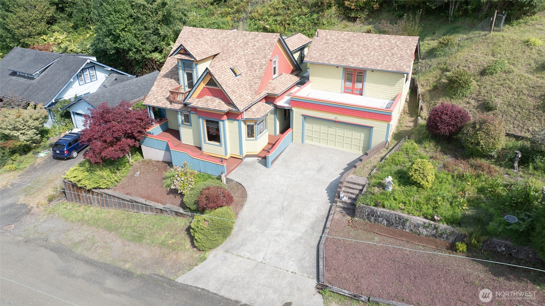 209 Ferry Street South Bend, WA 98586 - Photo 3 of 39 an aerial view of a house with a garden and plants