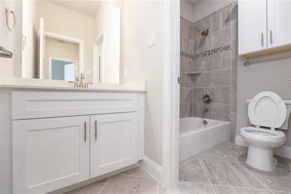 a bathroom with a sink a toilet and a bathtub