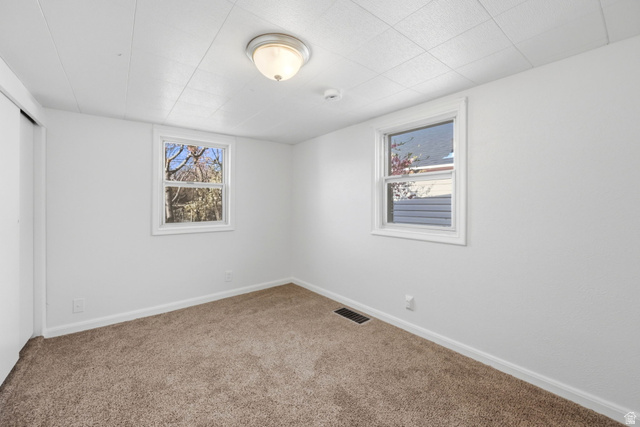 708 9th Street Ogden, UT 84404 - Photo 13 of 17 Carpeted empty room featuring baseboards
