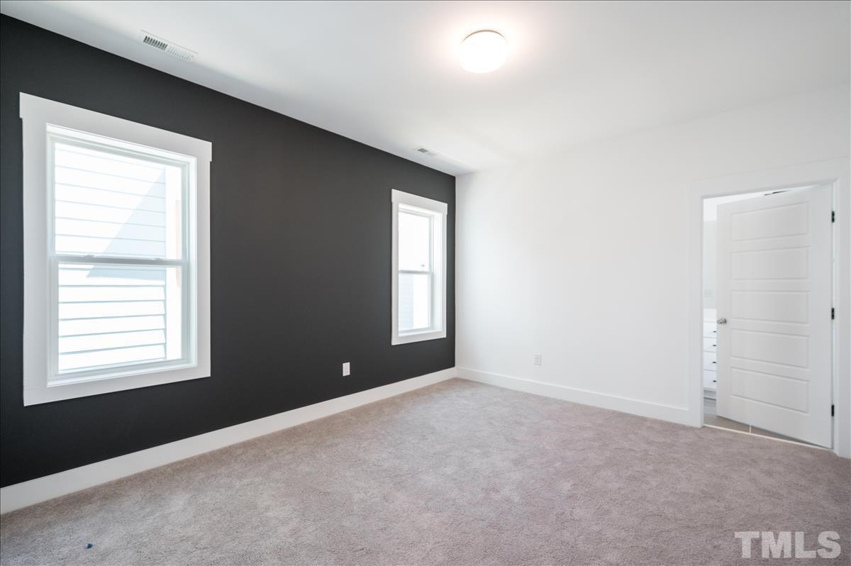 205 Daniel Ridge Road, Unit 1232 Wendell, NC 27591 - Photo 14 of 26 a view of an empty room with a window