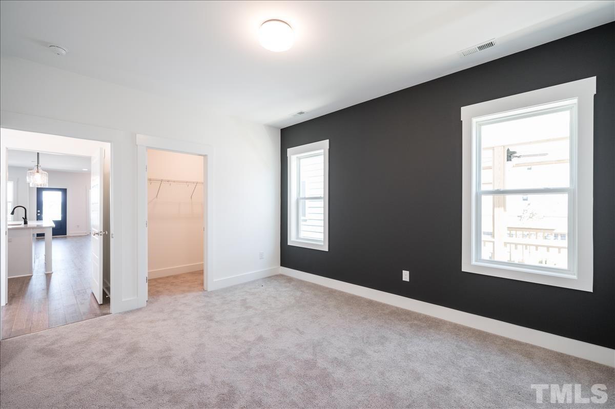 205 Daniel Ridge Road, Unit 1232 Wendell, NC 27591 - Photo 15 of 26 an empty room with windows and closet
