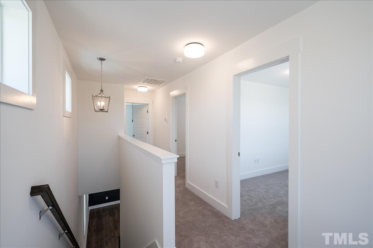205 Daniel Ridge Road, Unit 1232 Wendell, NC 27591 - Photo 19 of 26 a view of a hallway with workspace