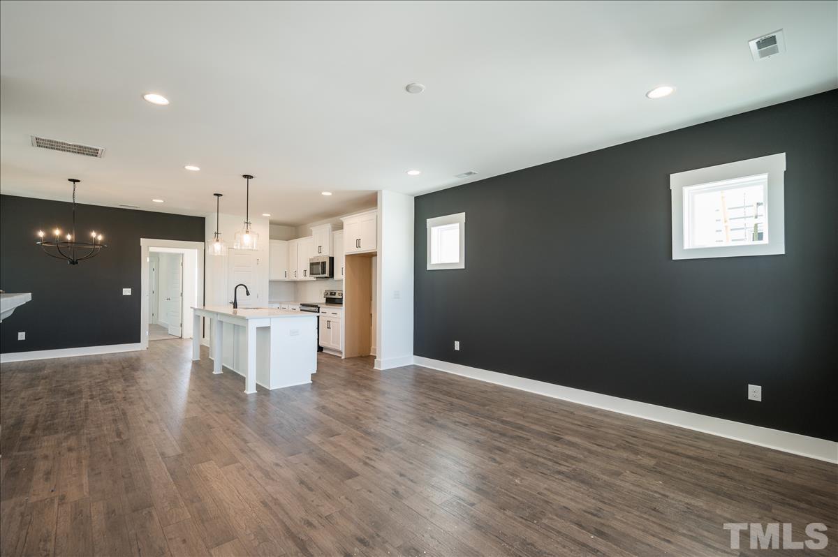 205 Daniel Ridge Road, Unit 1232 Wendell, NC 27591 - Photo 8 of 26 a view of kitchen with wooden floor