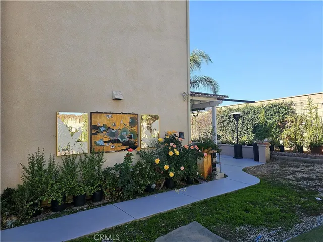 a front view of a house with a fountain