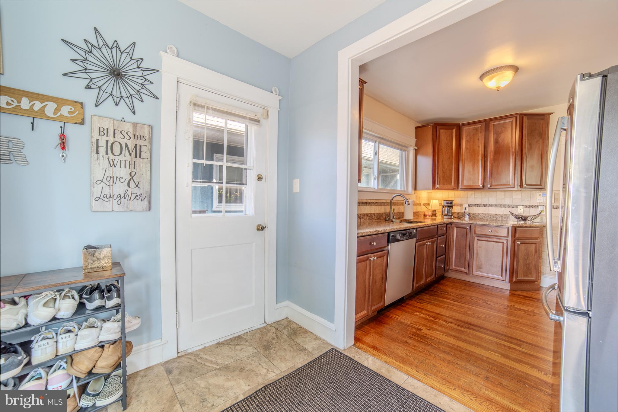 162 South Eagle Road Havertown, PA 19083 - Photo 12 of 30 a kitchen with stainless steel appliances granite countertop a stove a sink and a refrigerator