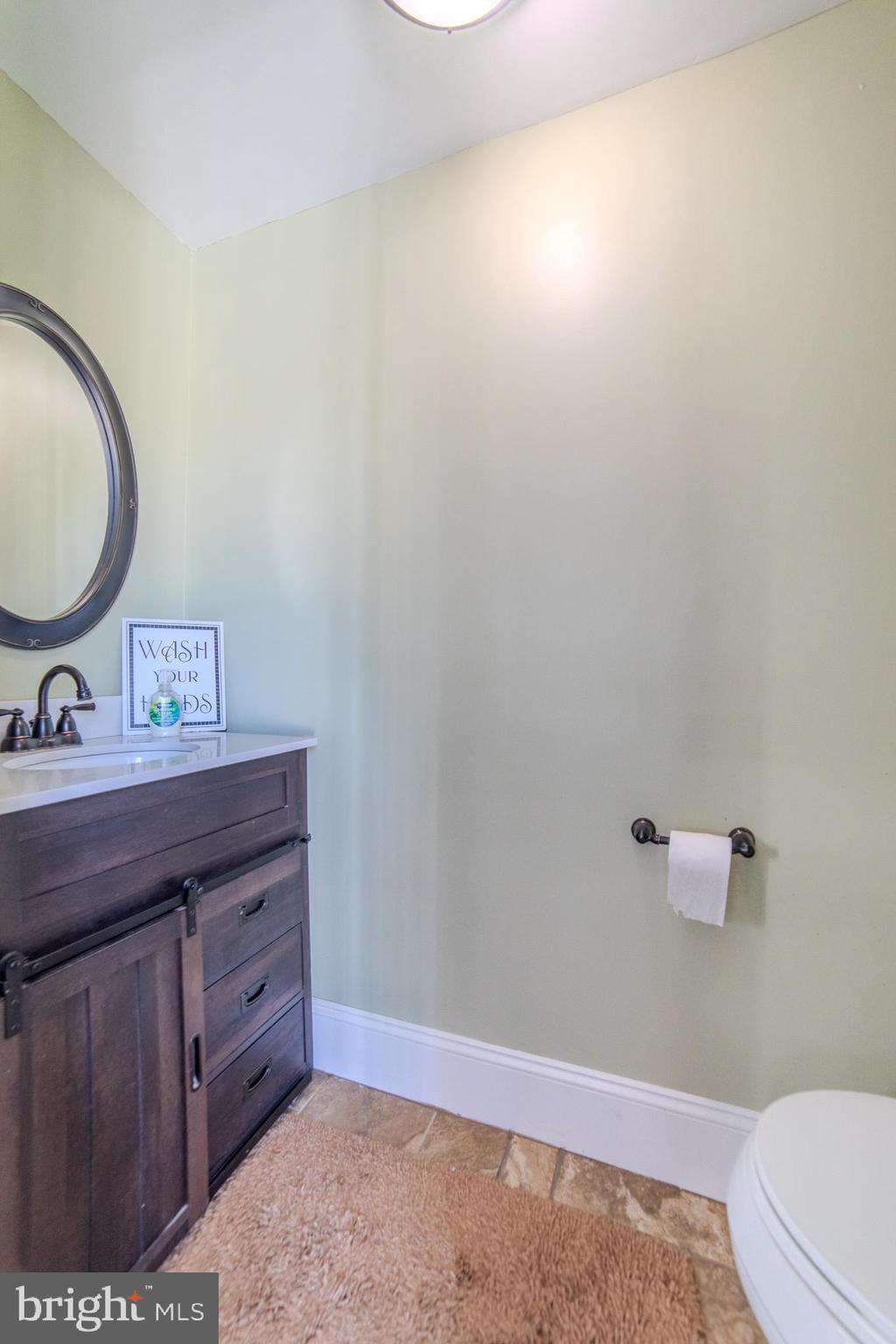 162 South Eagle Road Havertown, PA 19083 - Photo 13 of 30 a bathroom with a sink and a mirror