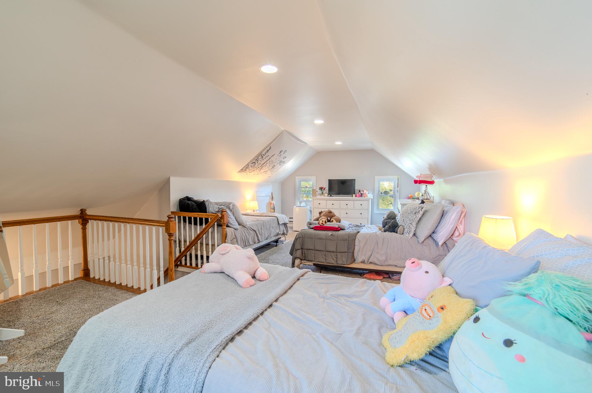 162 South Eagle Road Havertown, PA 19083 - Photo 19 of 30 a bed room with furniture and a chandelier