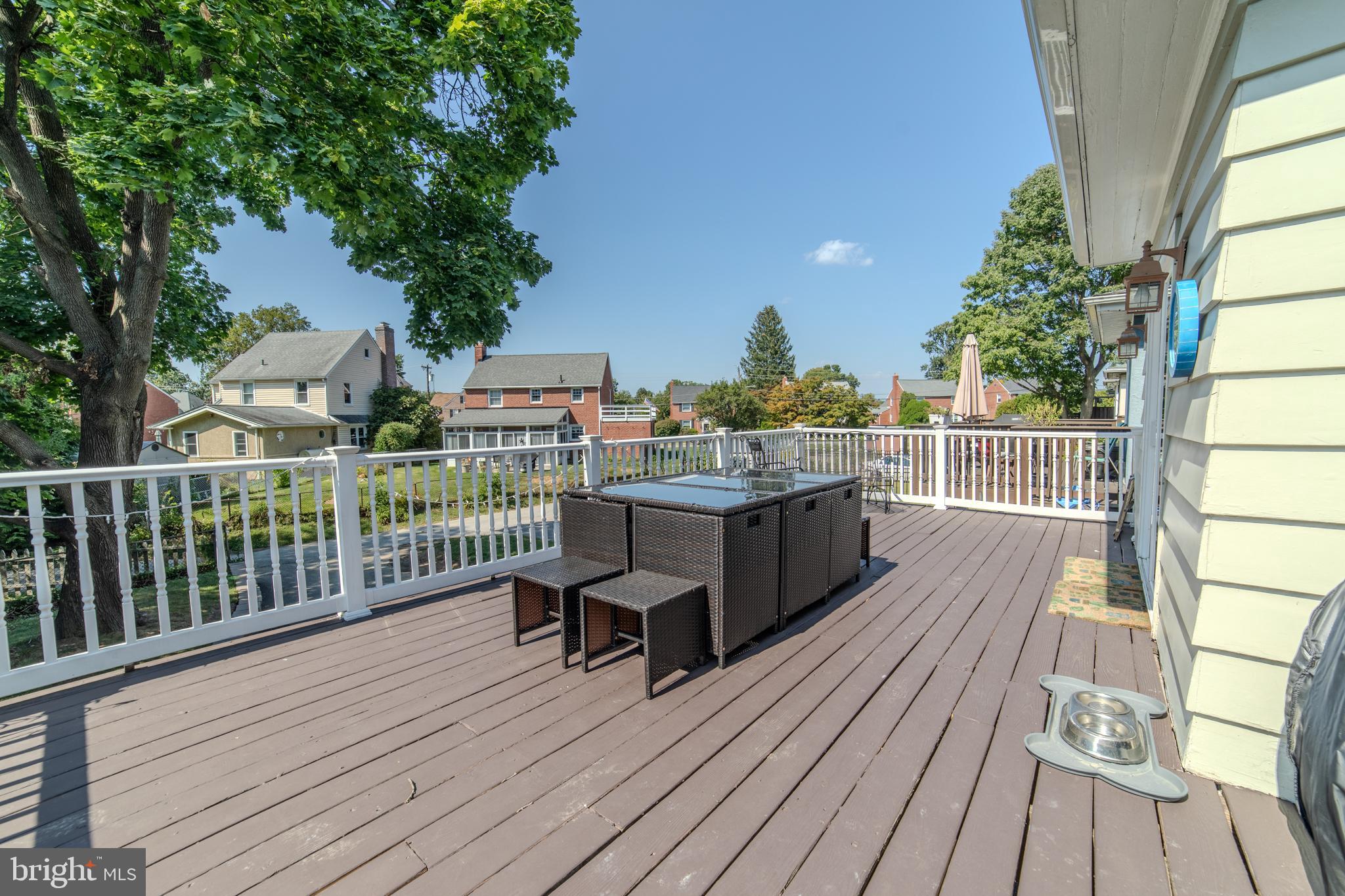 162 South Eagle Road Havertown, PA 19083 - Photo 22 of 30 a view of a balcony with wooden floor and outdoor seating