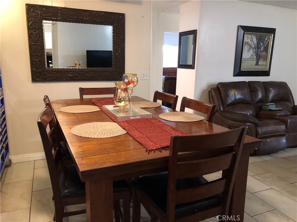 4901 Green River Road, Unit 113 Corona, CA 92878 - Photo 8 of 22 a view of a dining room with furniture