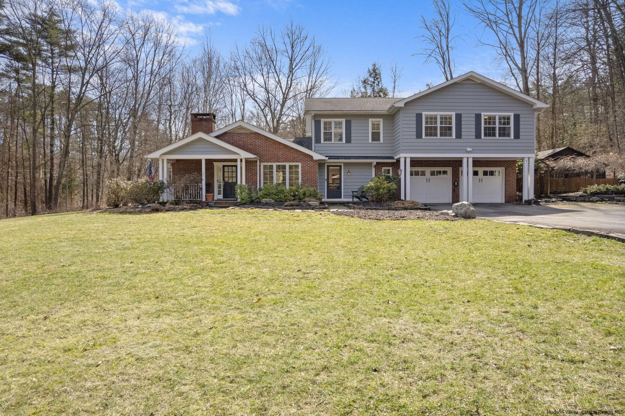 108 Ratterman Road Woodstock, NY 12498 - Photo 1 of 29 a front view of a house with a yard
