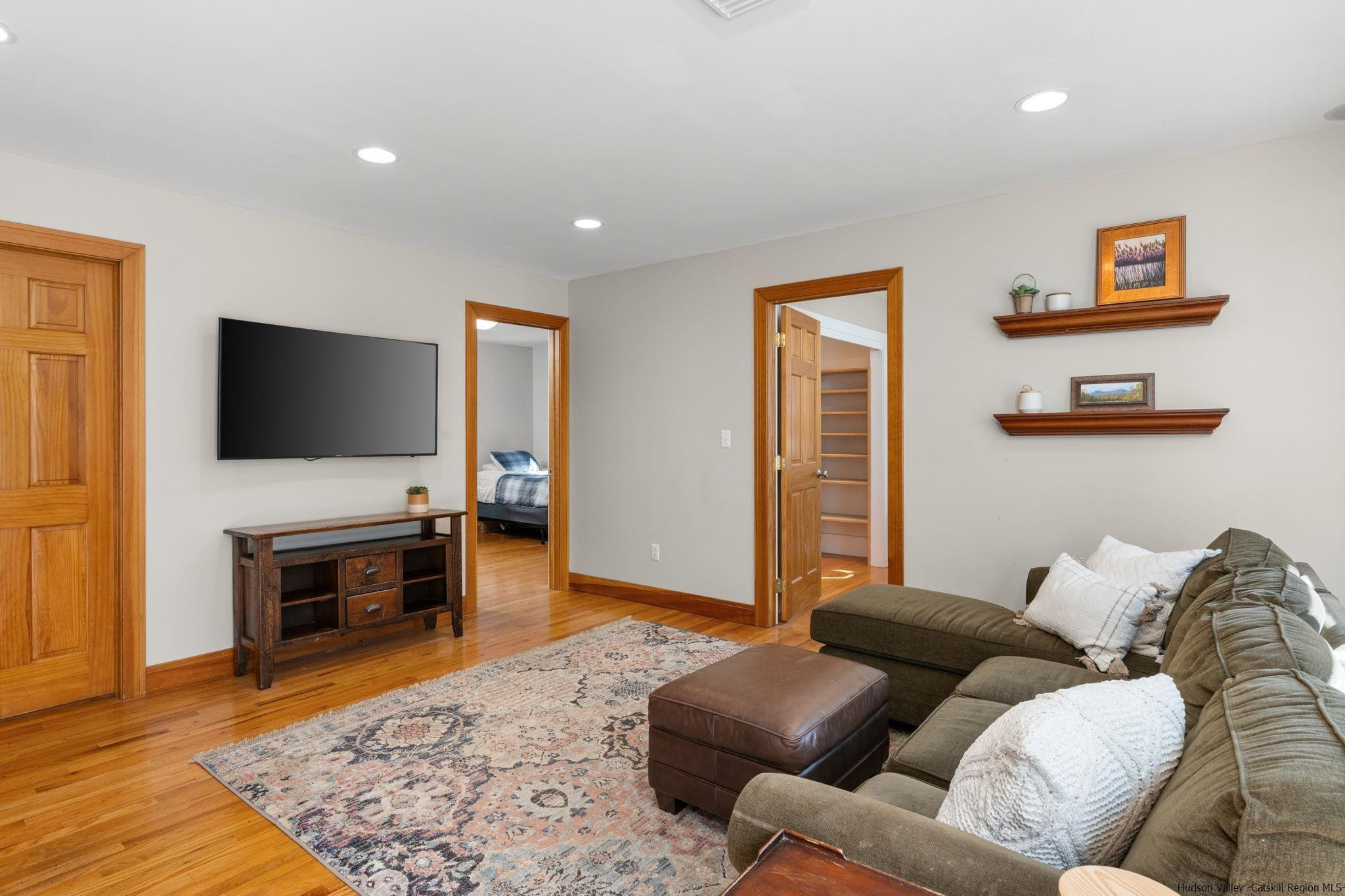 108 Ratterman Road Woodstock, NY 12498 - Photo 11 of 29 a living room with furniture and a flat screen tv