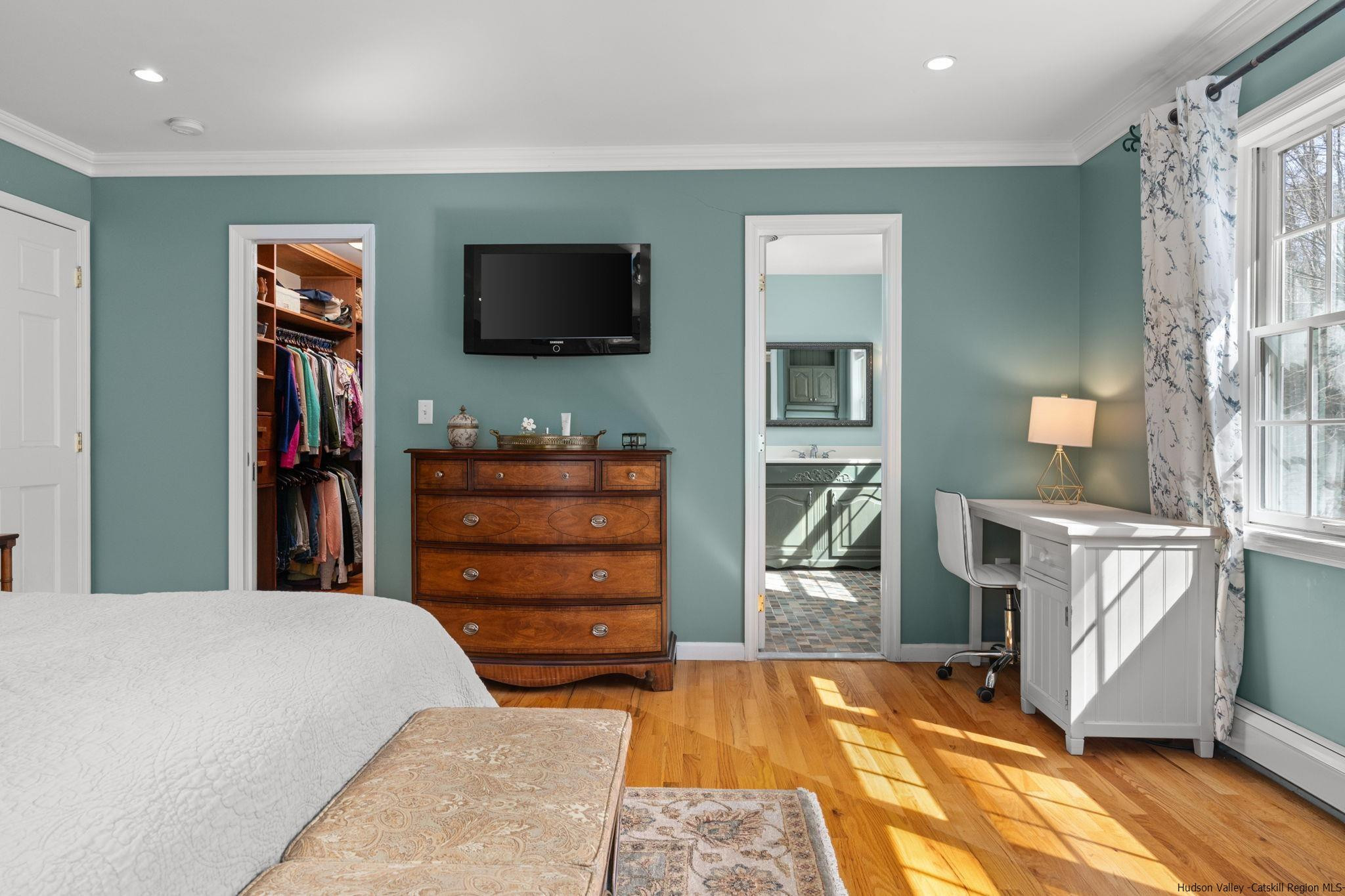 108 Ratterman Road Woodstock, NY 12498 - Photo 16 of 29 a bedroom with a bed and a flat screen tv