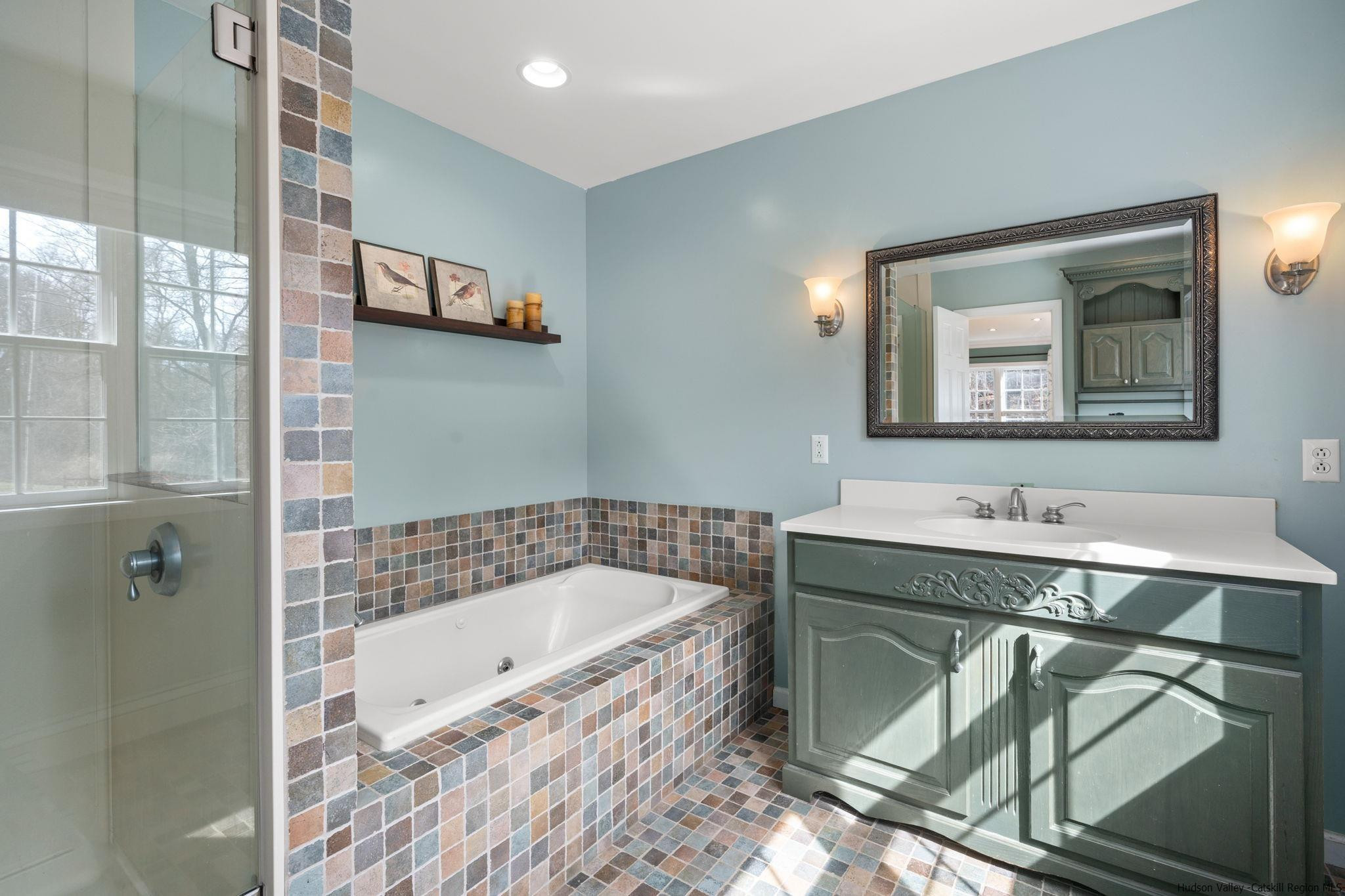 108 Ratterman Road Woodstock, NY 12498 - Photo 17 of 29 a bathroom with a tub a sink and mirror