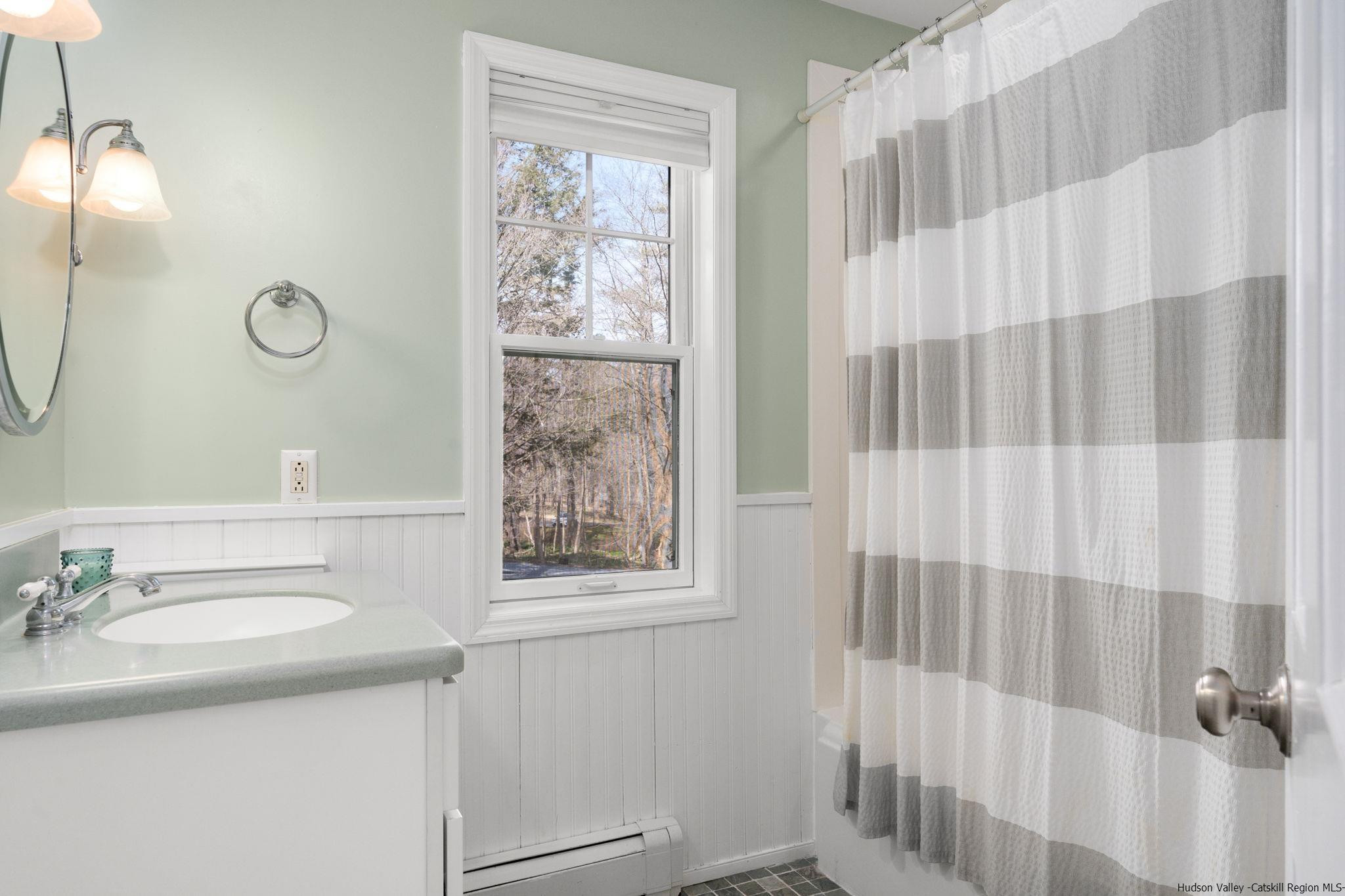108 Ratterman Road Woodstock, NY 12498 - Photo 19 of 29 a bathroom with a sink and a mirror