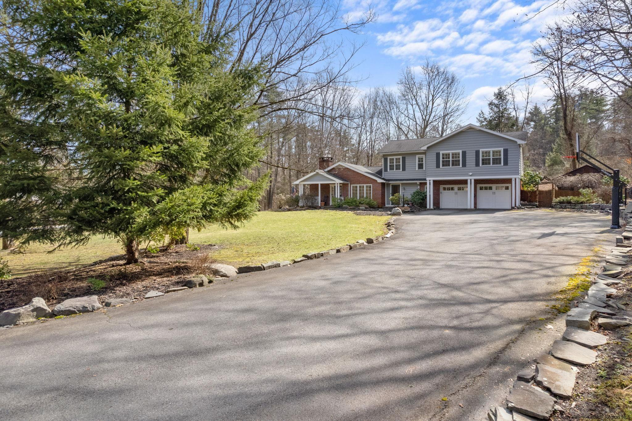 108 Ratterman Road Woodstock, NY 12498 - Photo 2 of 29 a front view of a house with a yard