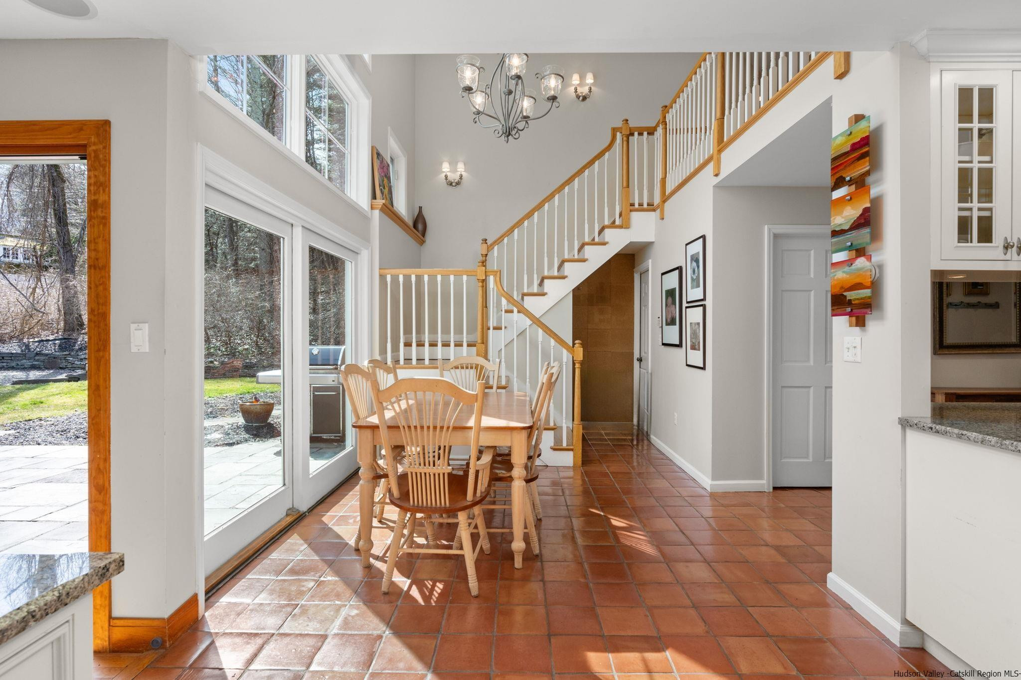 108 Ratterman Road Woodstock, NY 12498 - Photo 4 of 29 a dining room with furniture and a floor to ceiling window