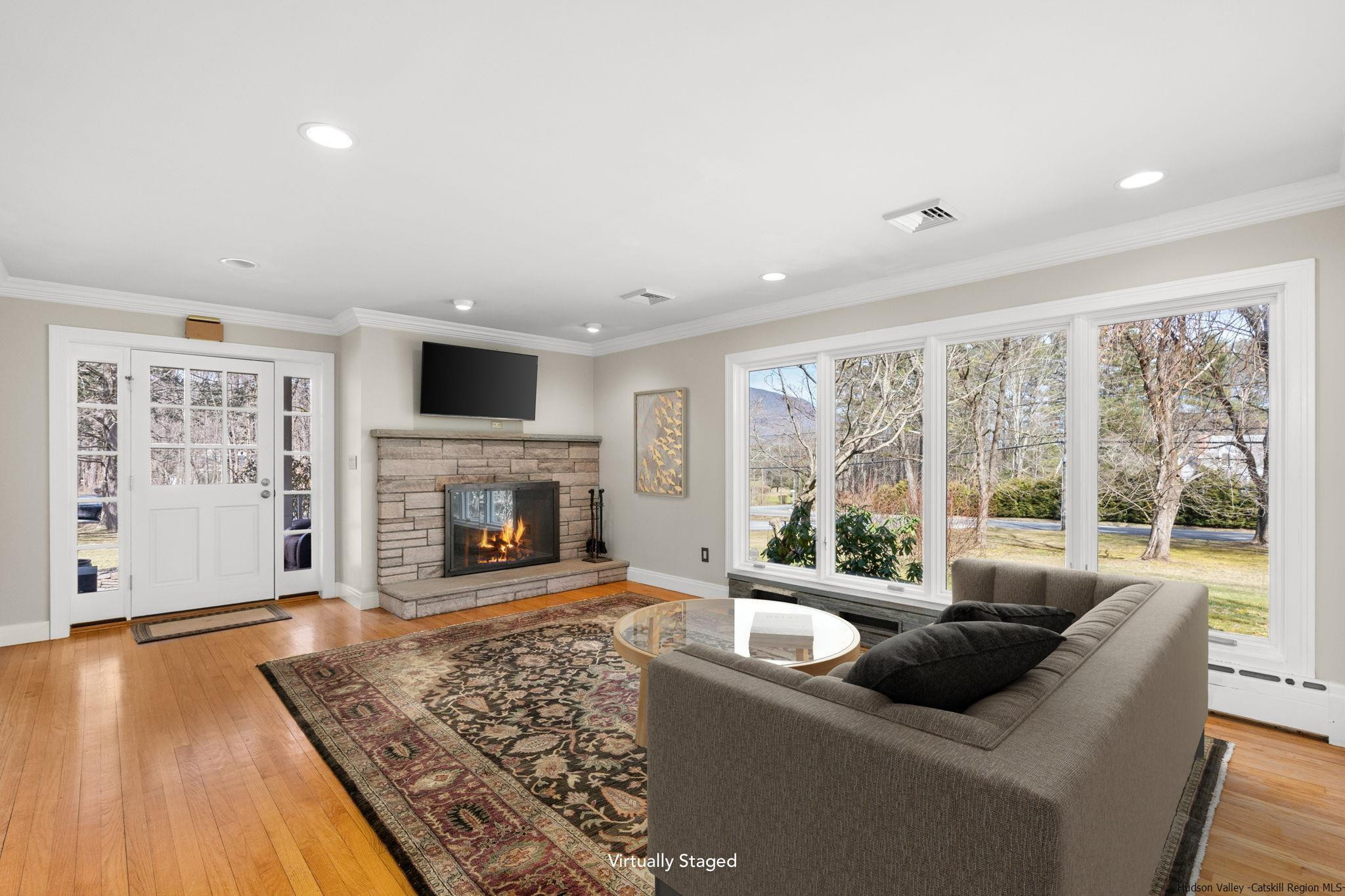 108 Ratterman Road Woodstock, NY 12498 - Photo 10 of 29 a living room with furniture and a fireplace