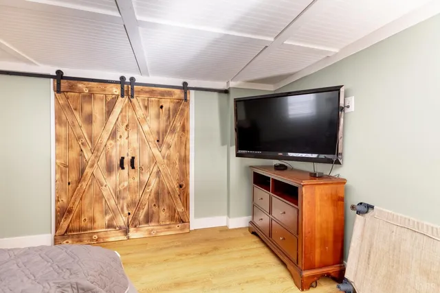 a view of kitchen with furniture and flat screen tv