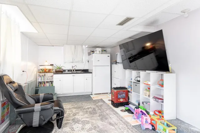 a kitchen with refrigerator and washer