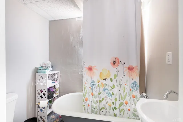 a house view with a wooden bench and large windows