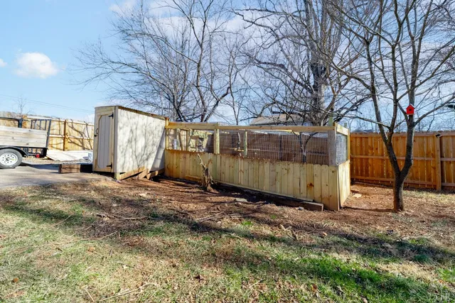 a swimming pool with some trees in the background
