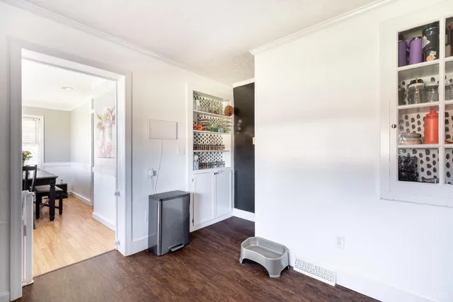 wooden floor in a livingroom and a dining room with furniture