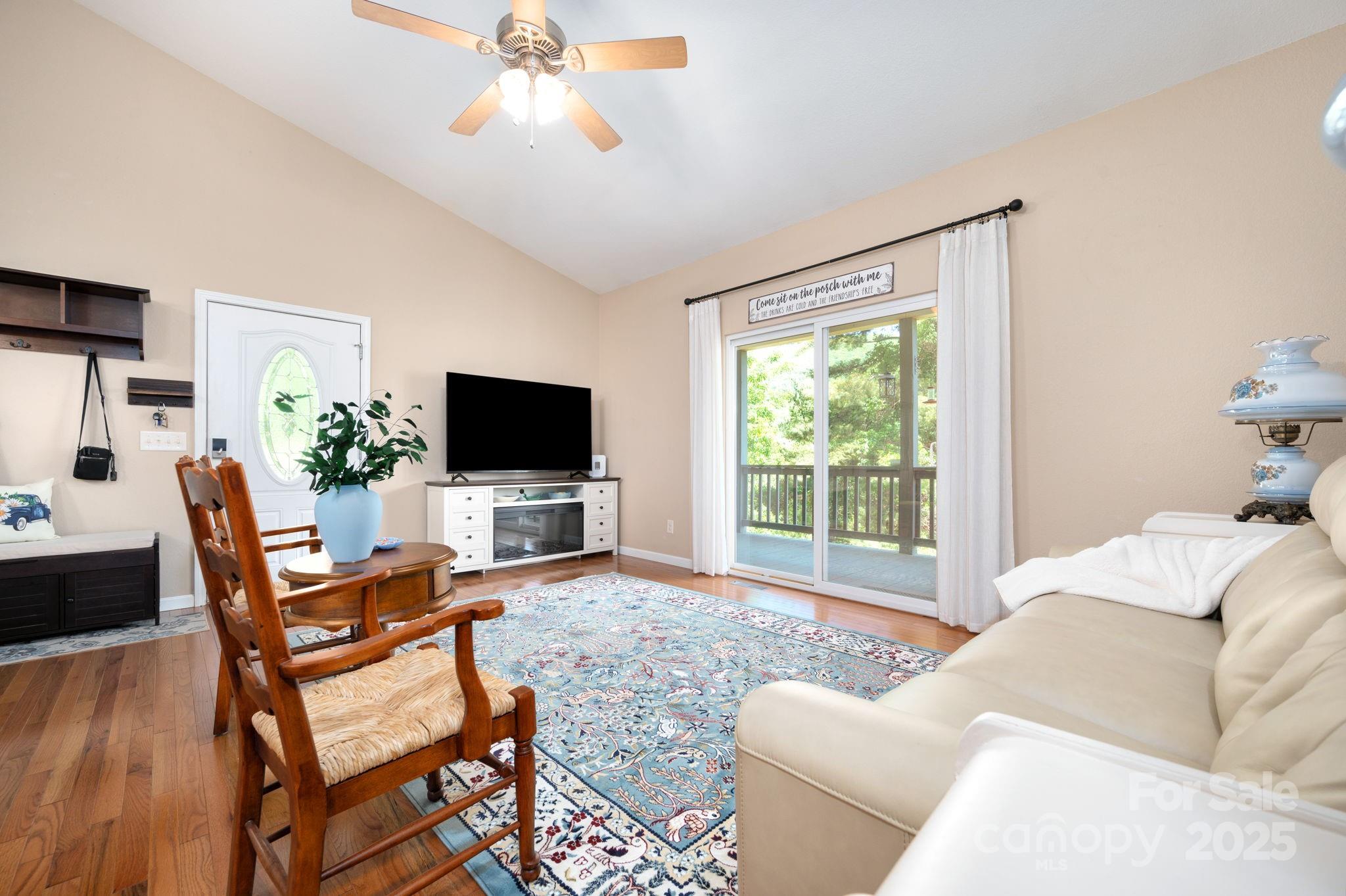 174 Diamond Point Canton, NC 28716 - Photo 11 of 30 a living room with furniture a flat screen tv and a large window
