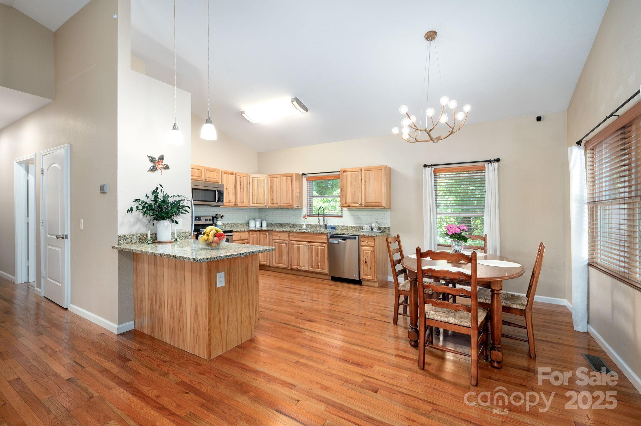 174 Diamond Point Canton, NC 28716 - Photo 12 of 30 a view of a dining room with furniture and wooden floor