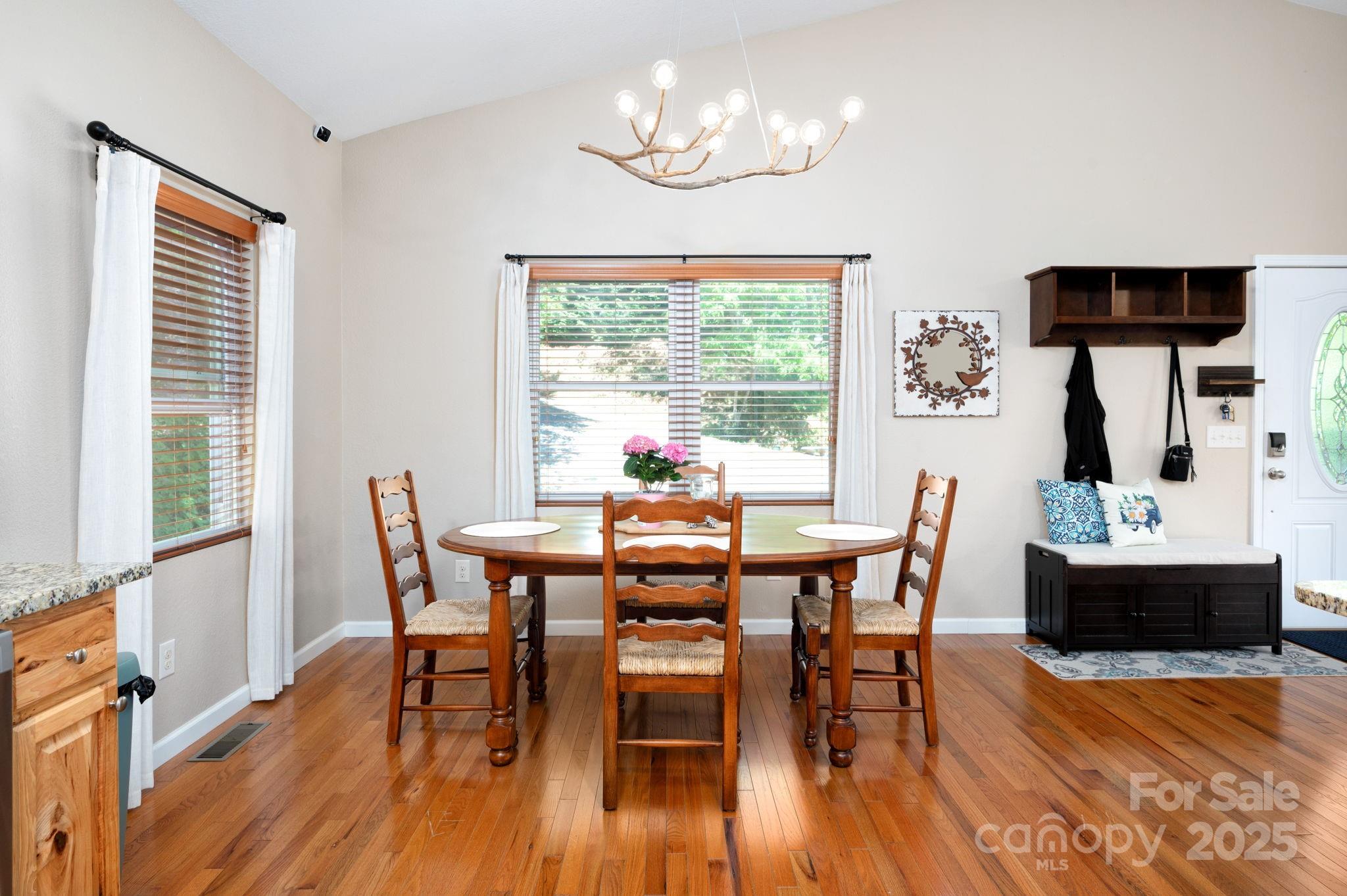 174 Diamond Point Canton, NC 28716 - Photo 14 of 30 a view of a dining room with furniture window and wooden floor