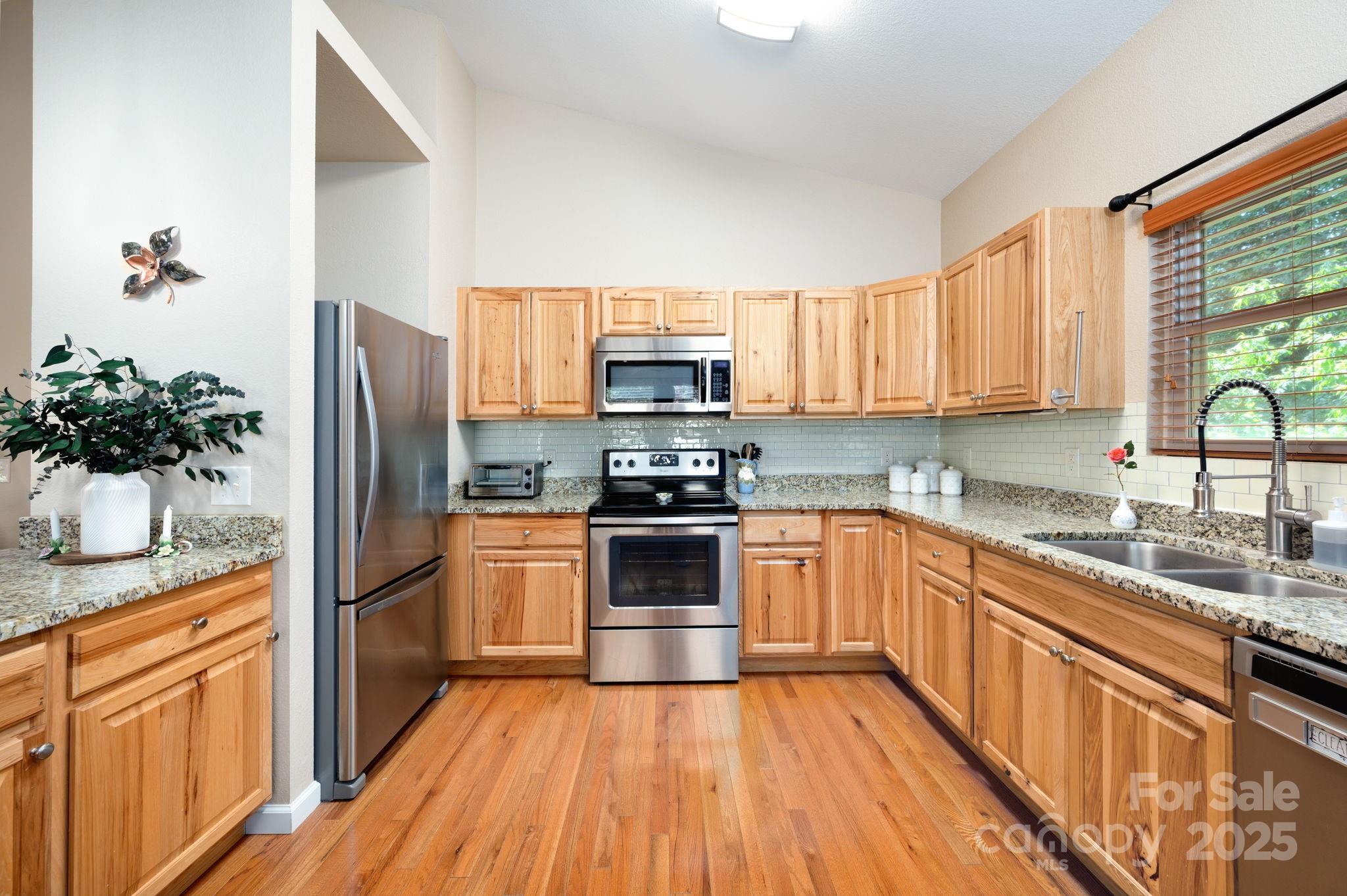 174 Diamond Point Canton, NC 28716 - Photo 15 of 30 a kitchen with granite countertop a refrigerator and a sink