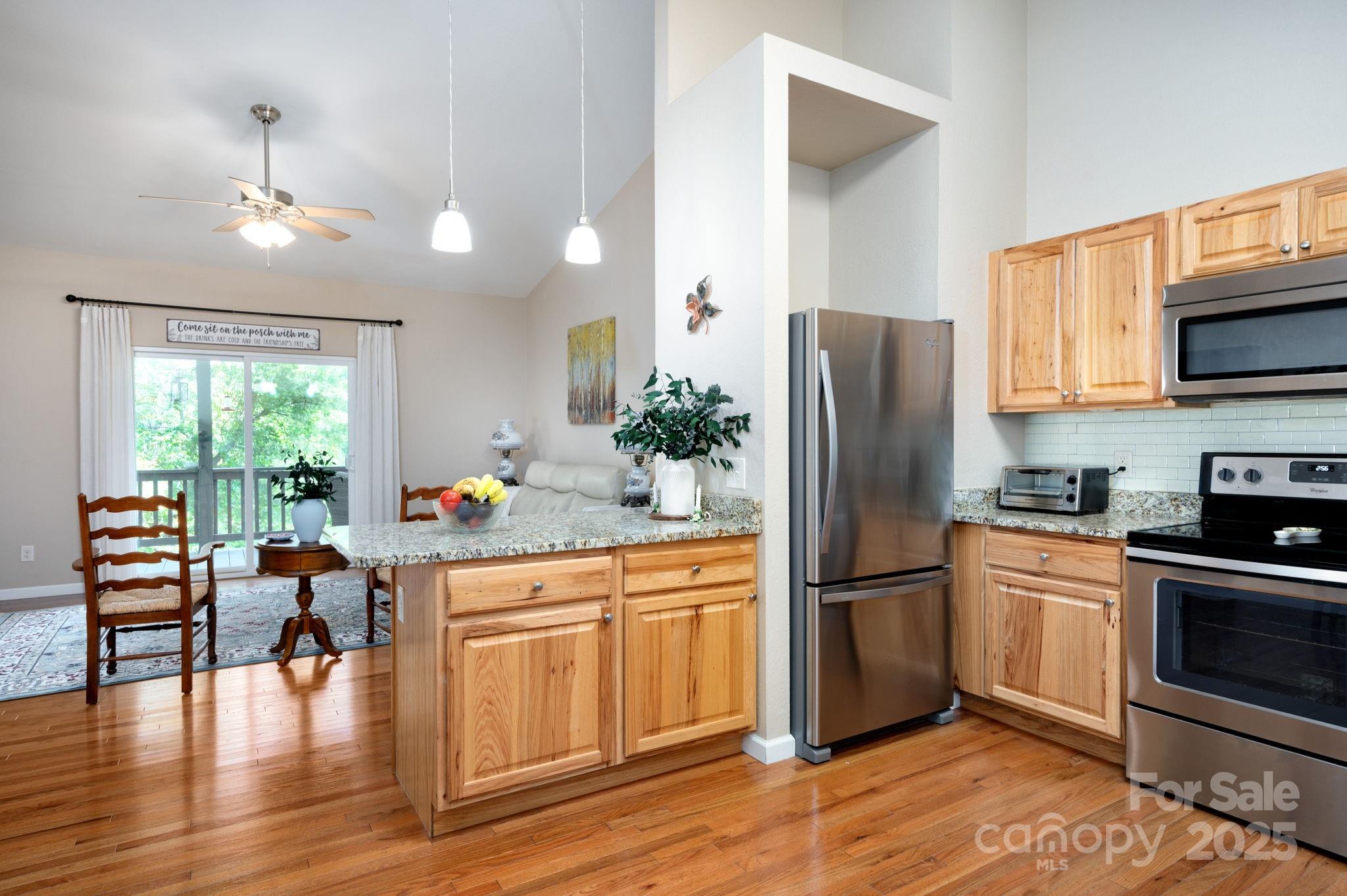 174 Diamond Point Canton, NC 28716 - Photo 16 of 30 a kitchen with a refrigerator microwave and stove top oven