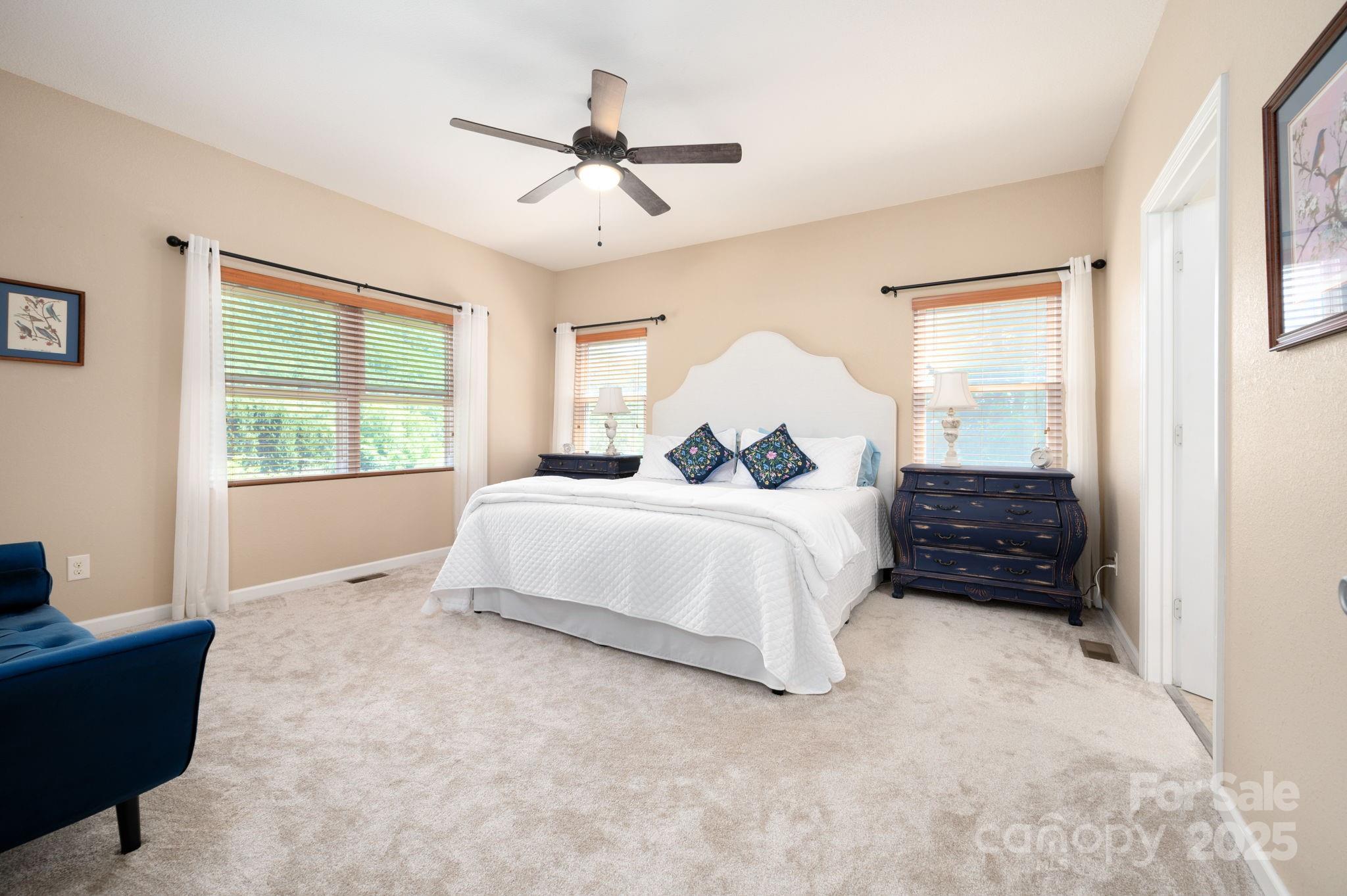 174 Diamond Point Canton, NC 28716 - Photo 17 of 30 a bedroom with a bed a window and a couch