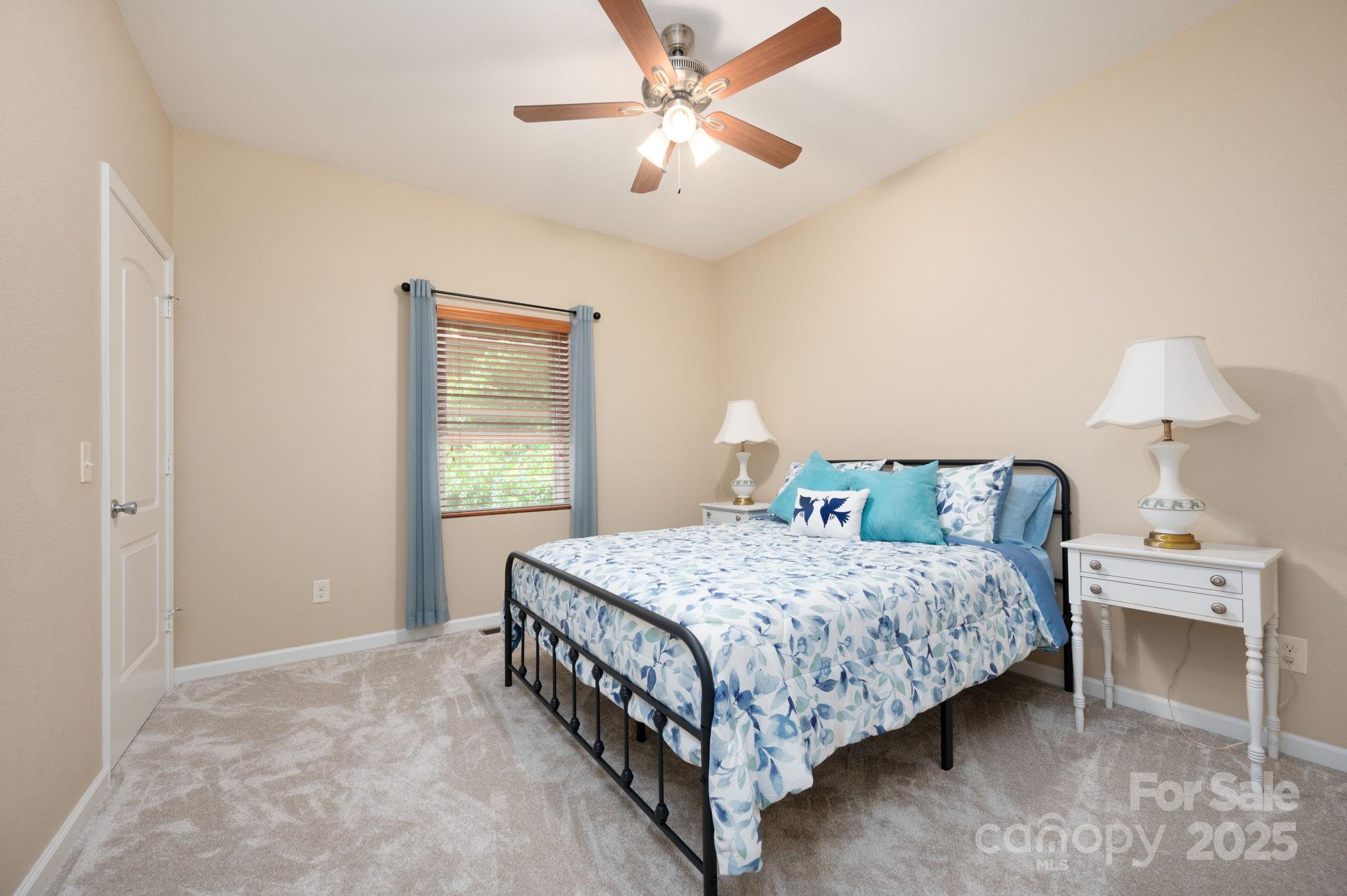 174 Diamond Point Canton, NC 28716 - Photo 24 of 30 a bedroom with a bed chandelier and a window