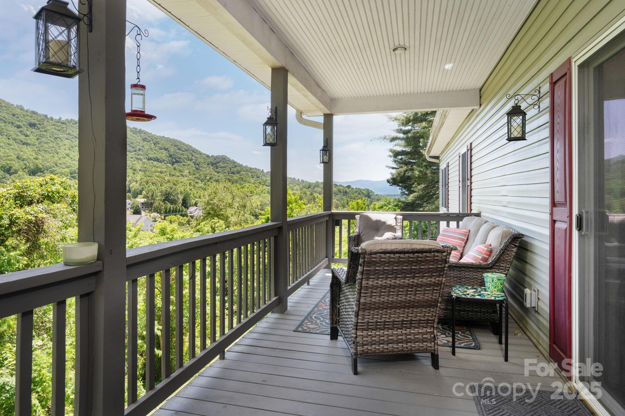 174 Diamond Point Canton, NC 28716 - Photo 4 of 30 a view of a two chairs in the balcony
