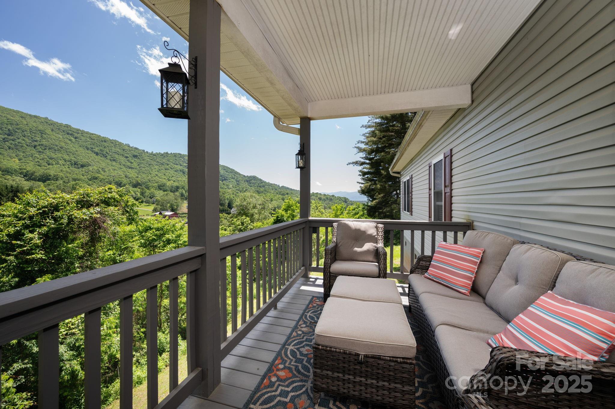174 Diamond Point Canton, NC 28716 - Photo 5 of 30 a view of a two chairs in the balcony