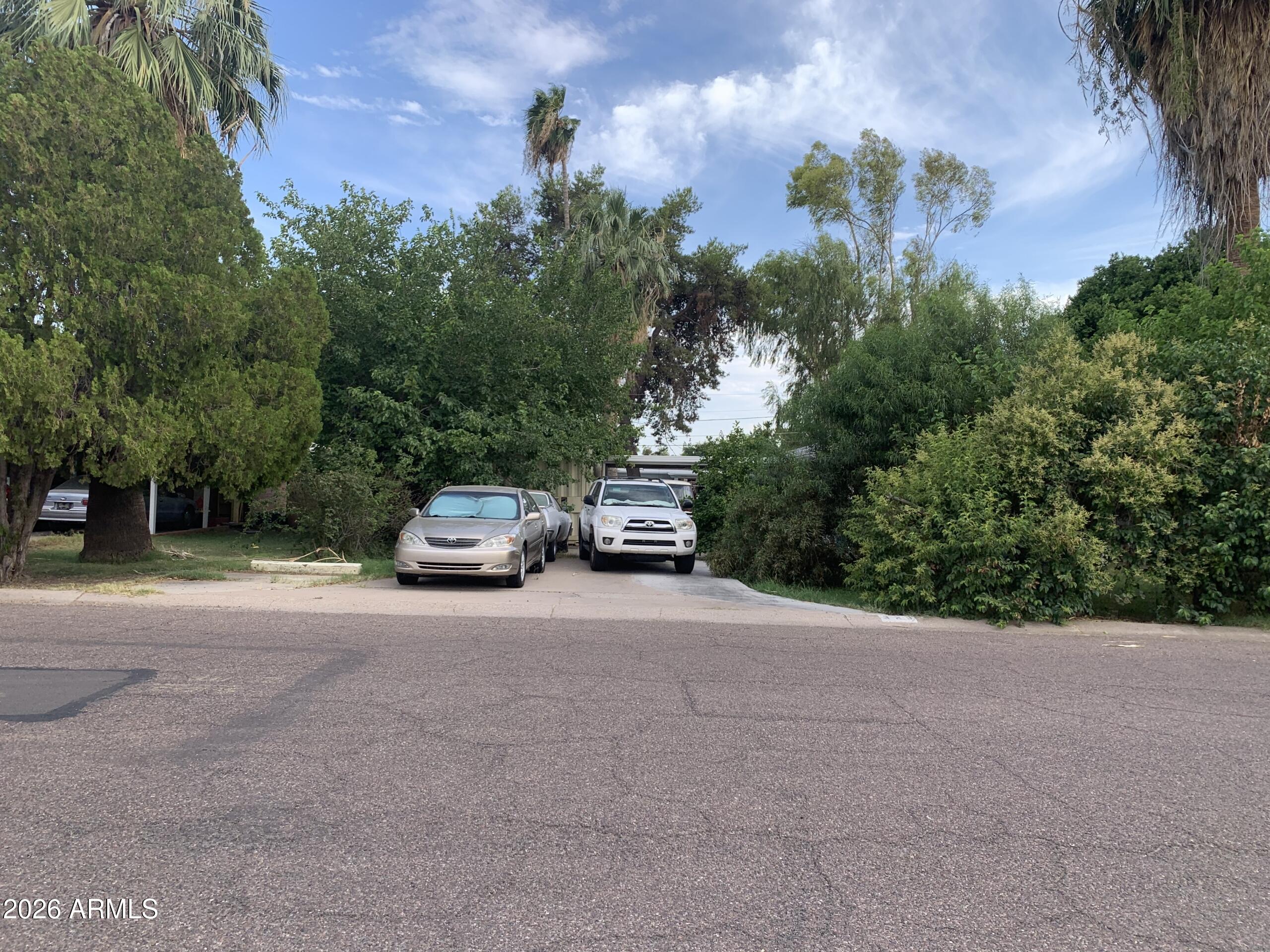 323 East Rose Lane Phoenix, AZ 85012 - Photo 2 of 20 a car parked on the side of the road