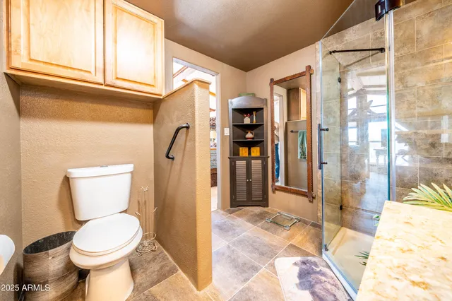 a open kitchen with stainless steel appliances granite countertop a stove and refrigerator