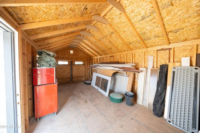 a view of storage and utility room with two washing machine