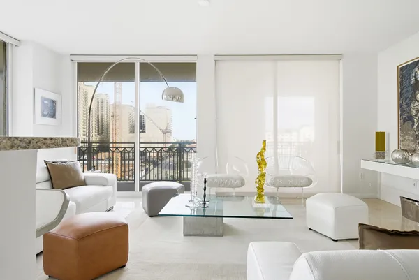 a living room with furniture and a table