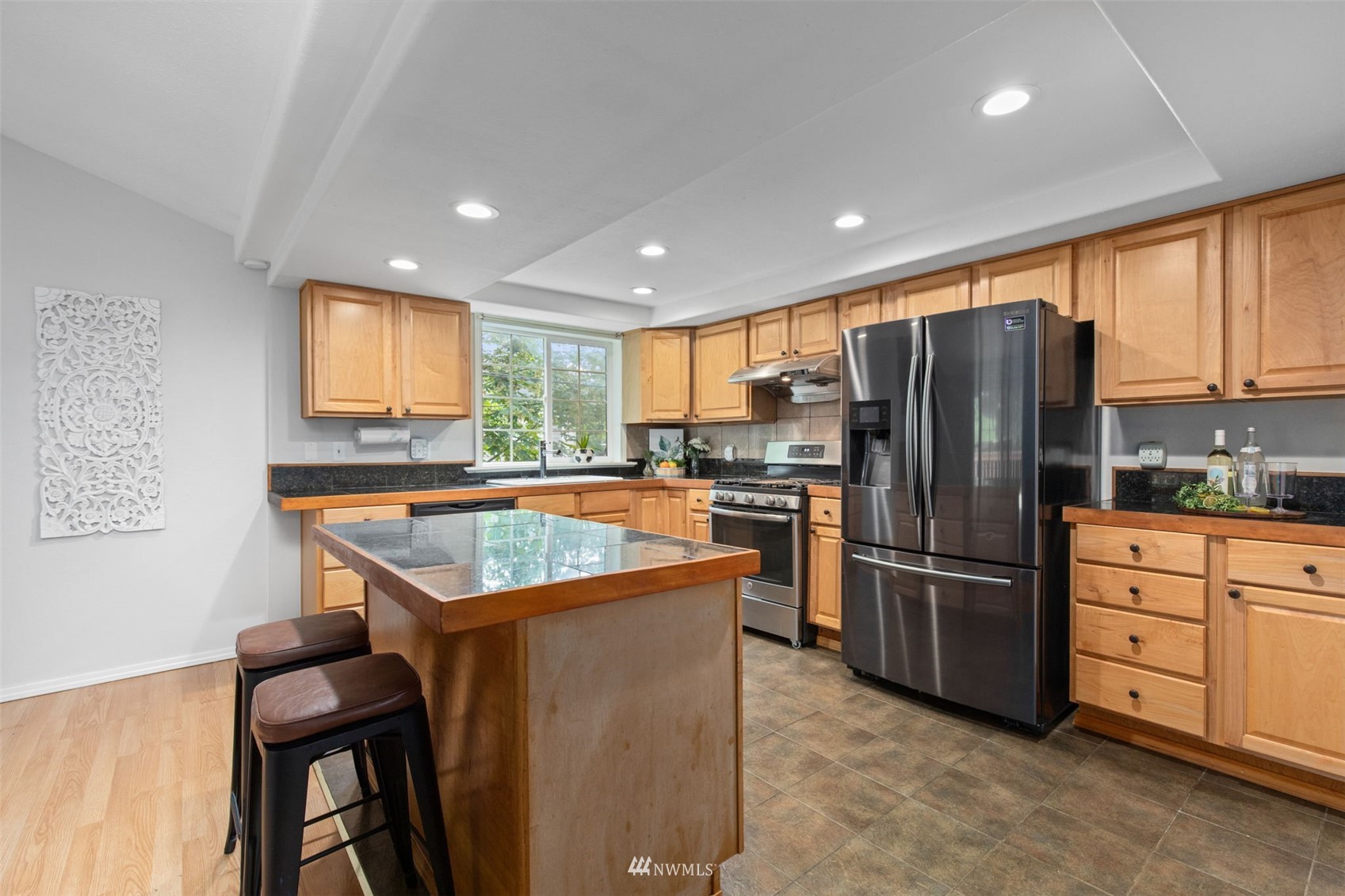 819 Duchess Road Bothell, WA 98012 - Photo 13 of 40 a kitchen with refrigerator cabinets and window