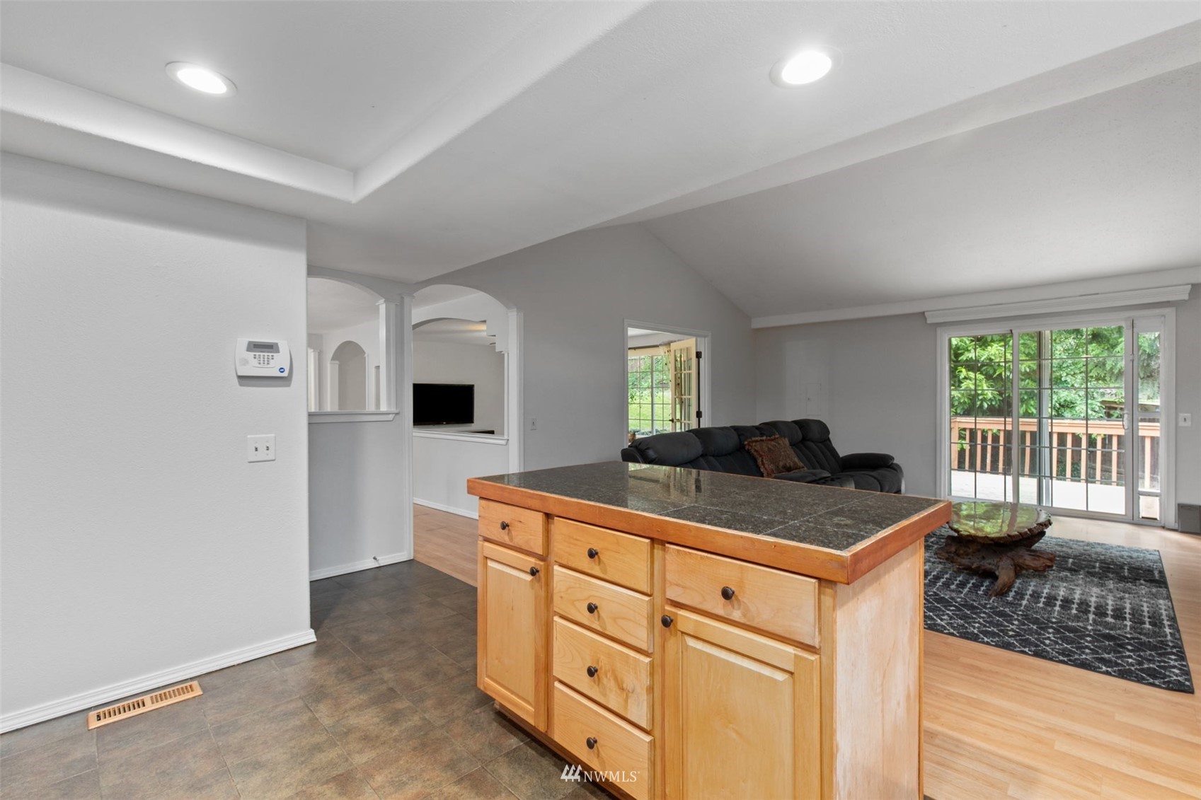 819 Duchess Road Bothell, WA 98012 - Photo 17 of 40 a kitchen with stainless steel appliances granite countertop a stove a sink and a refrigerator