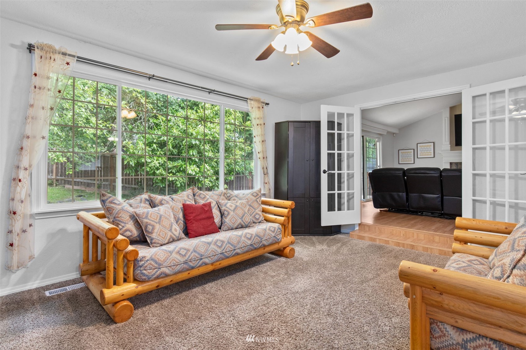 819 Duchess Road Bothell, WA 98012 - Photo 2 of 40 a living room with furniture and a large window