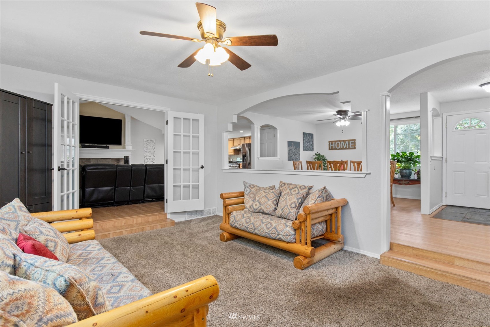 819 Duchess Road Bothell, WA 98012 - Photo 3 of 40 a living room with furniture and a flat screen tv