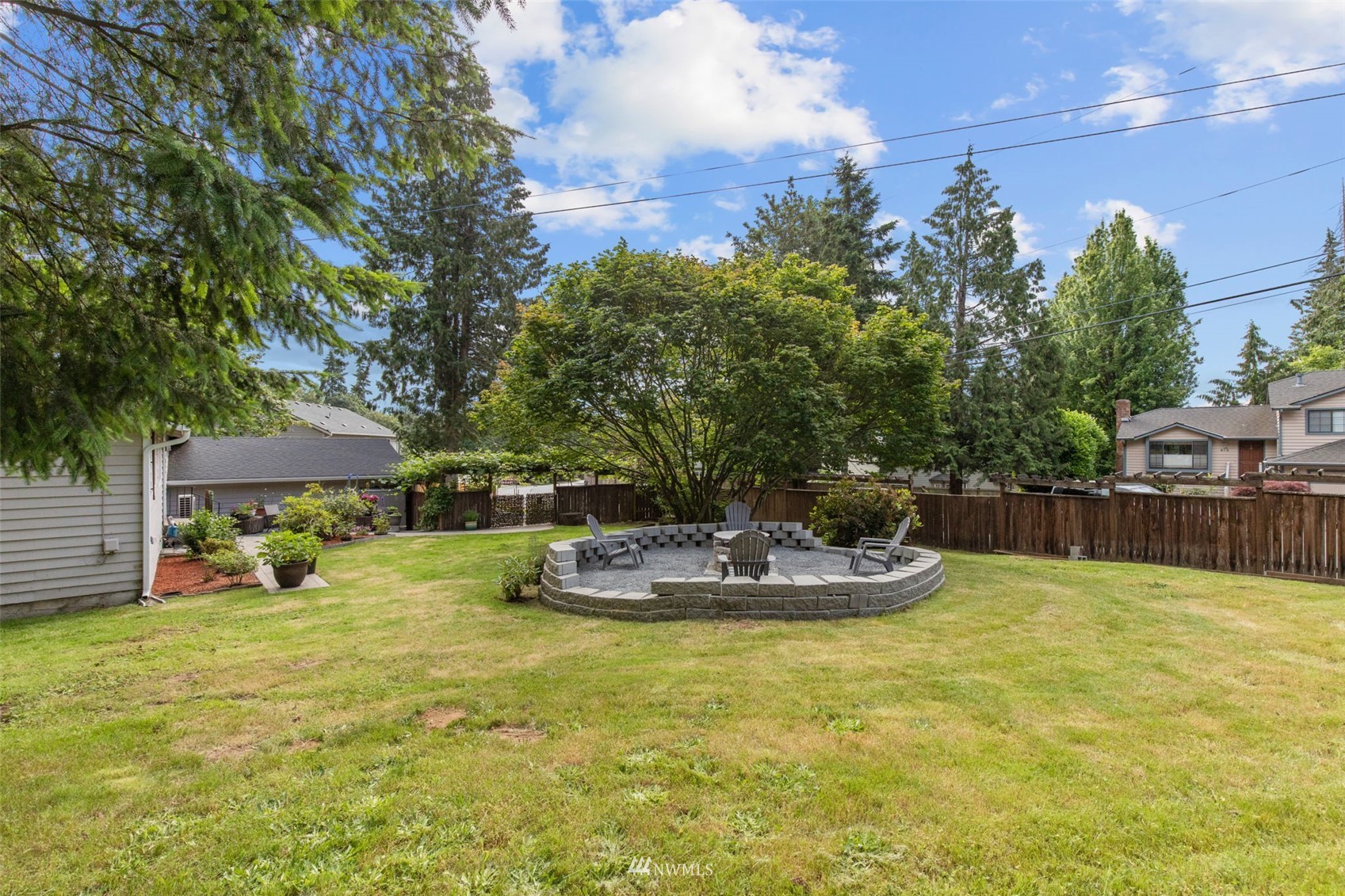 819 Duchess Road Bothell, WA 98012 - Photo 39 of 40 a view of a swimming pool with a yard