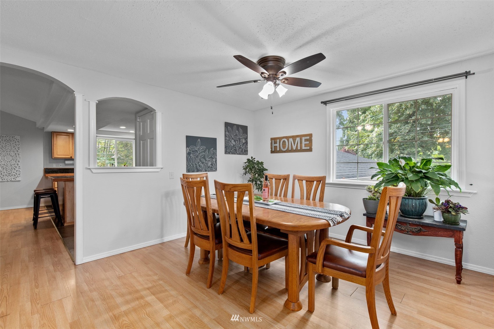 819 Duchess Road Bothell, WA 98012 - Photo 6 of 40 a view of a dining room with furniture window and wooden floor
