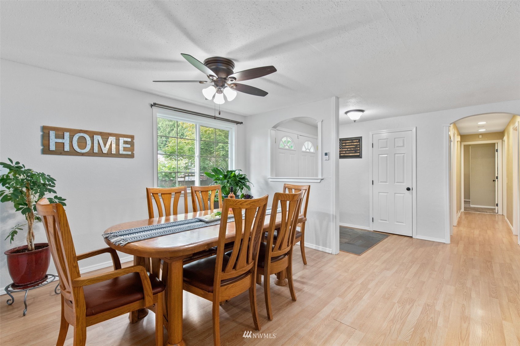 819 Duchess Road Bothell, WA 98012 - Photo 7 of 40 a view of a dining room with furniture window and wooden floor