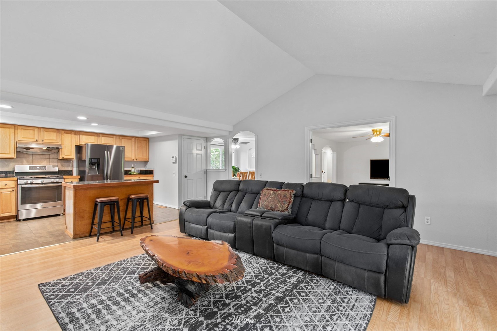 819 Duchess Road Bothell, WA 98012 - Photo 10 of 40 a living room with furniture and a fireplace
